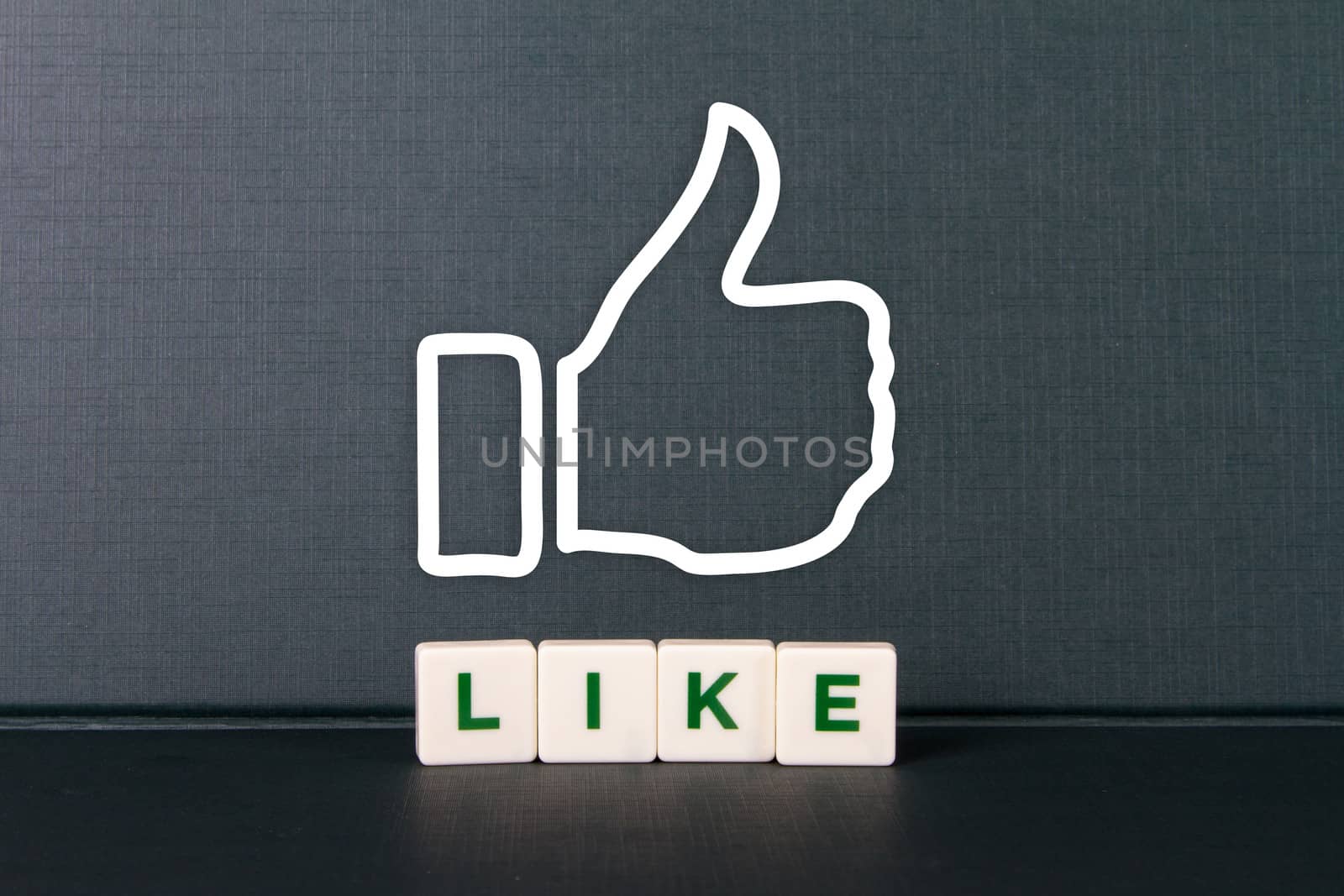 Like word in letters and thumb up of hand icon.