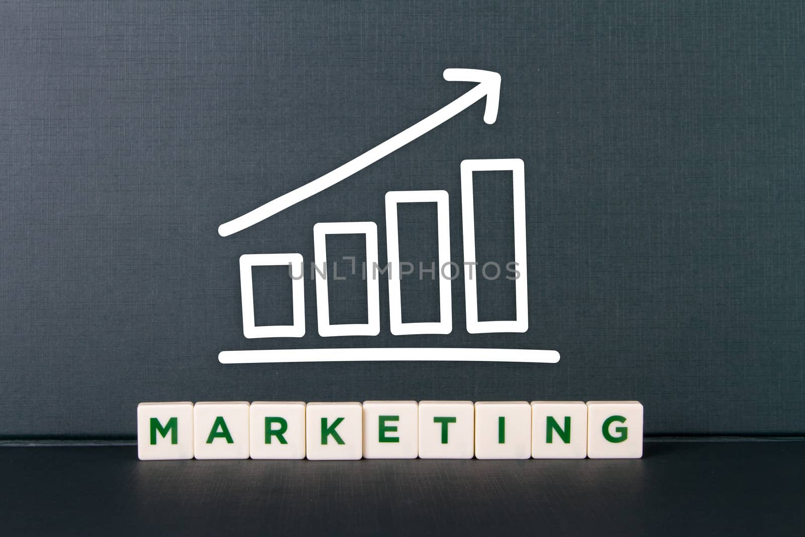 Marketing word in letters with bar chart of growth.