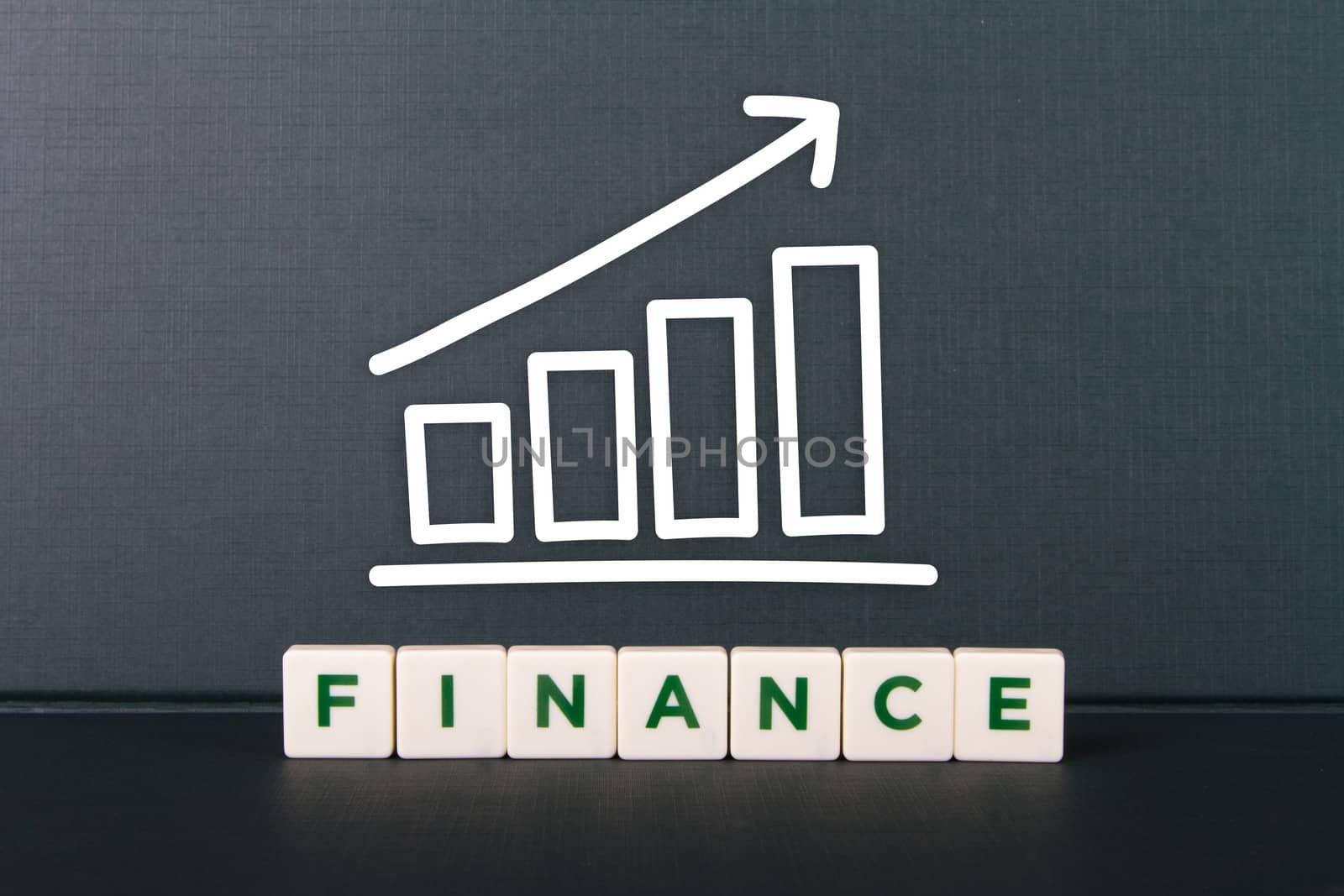 Finance word in letters and growth chart.