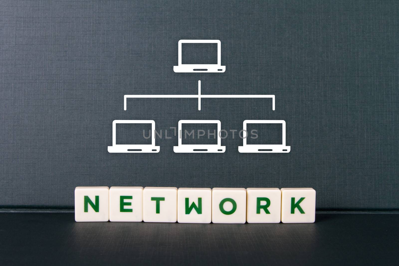 Network word in letters and laptop icons which are interconnected to each other.