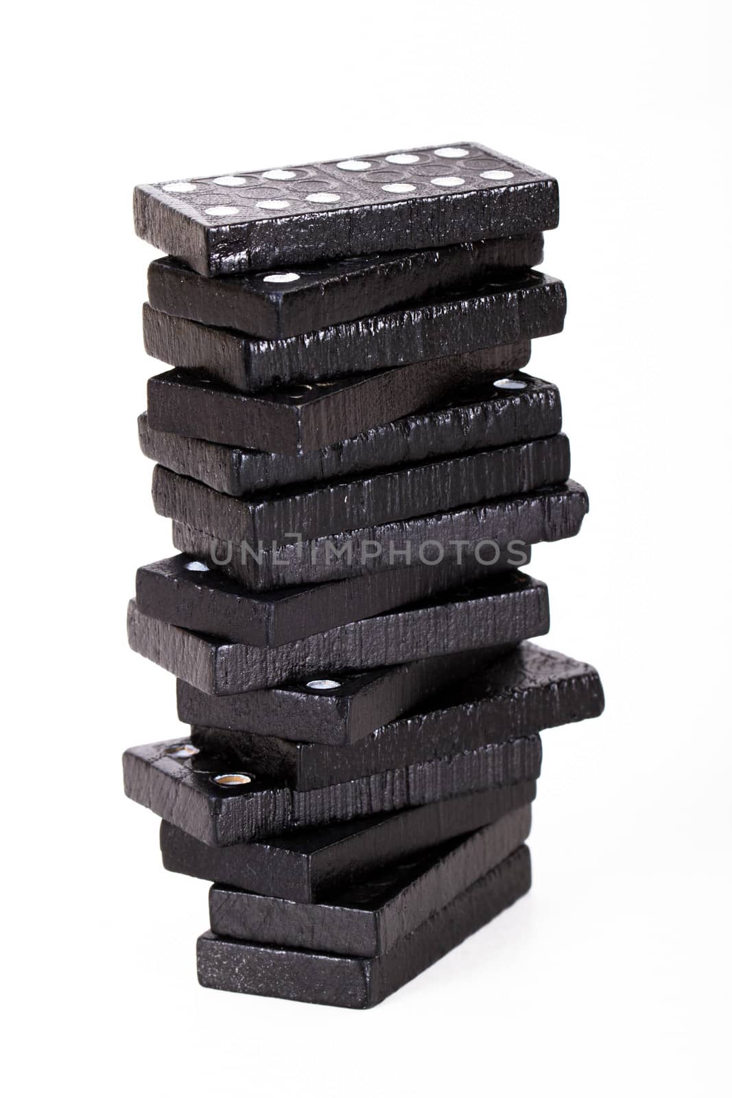 Stack of dominoes, isolated on white background.