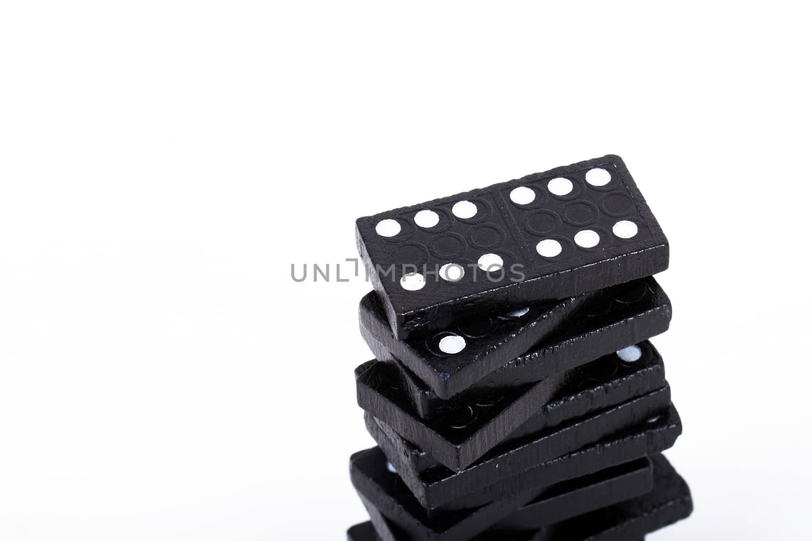 Stack of dominoes, isolated on white background.