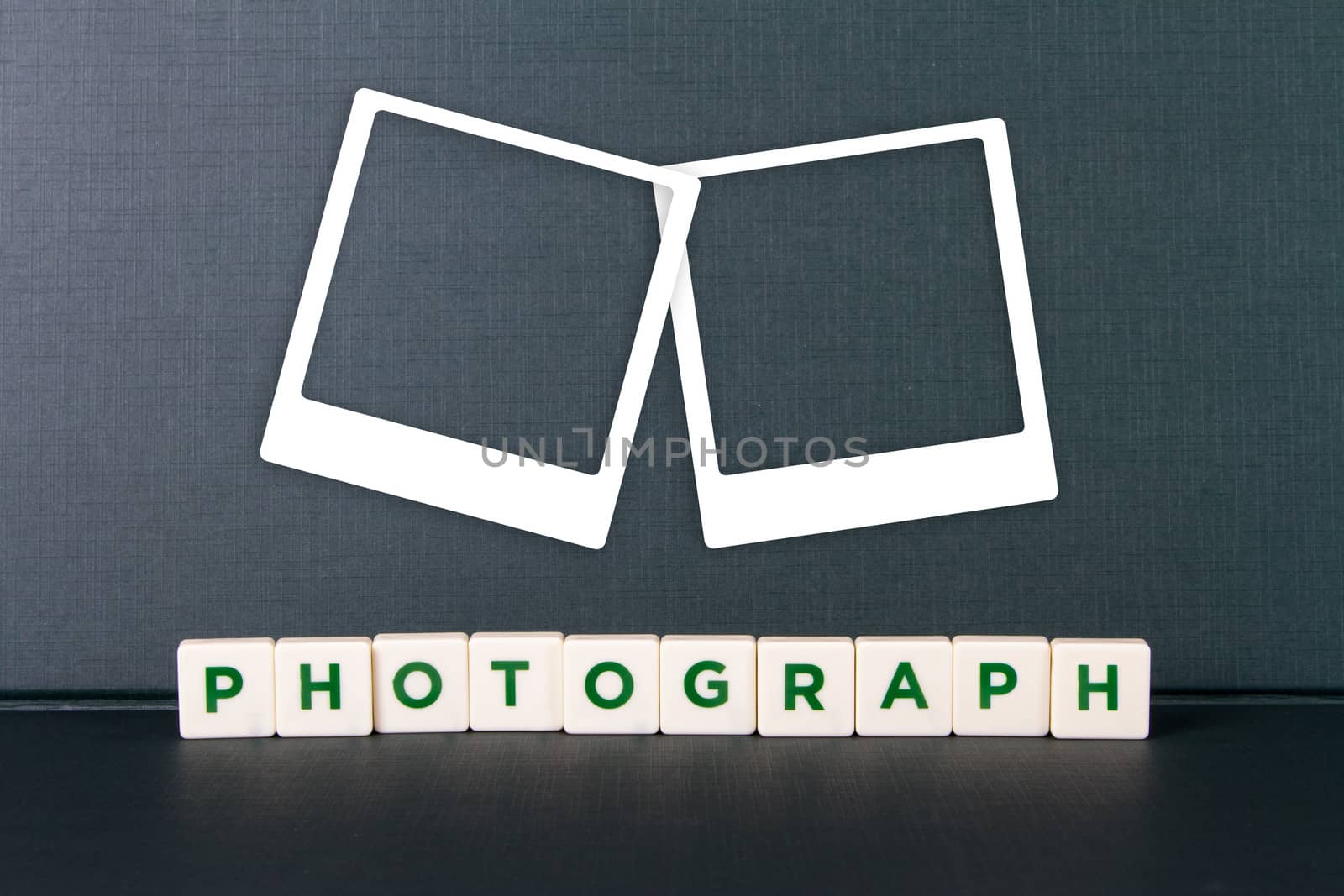 Photography word in letters and white photo frames.