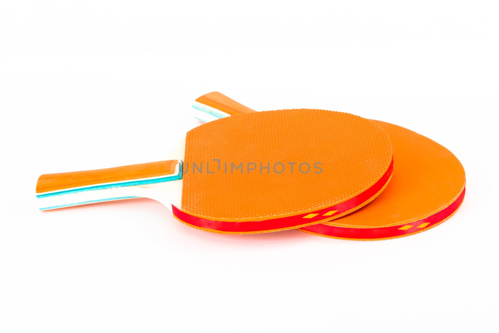 Two rackets for playing table tennis, isolated on white background.