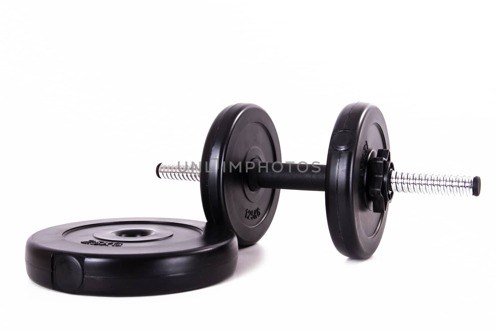 Black gym barbell, dumbbell and disks, isolated on white background.