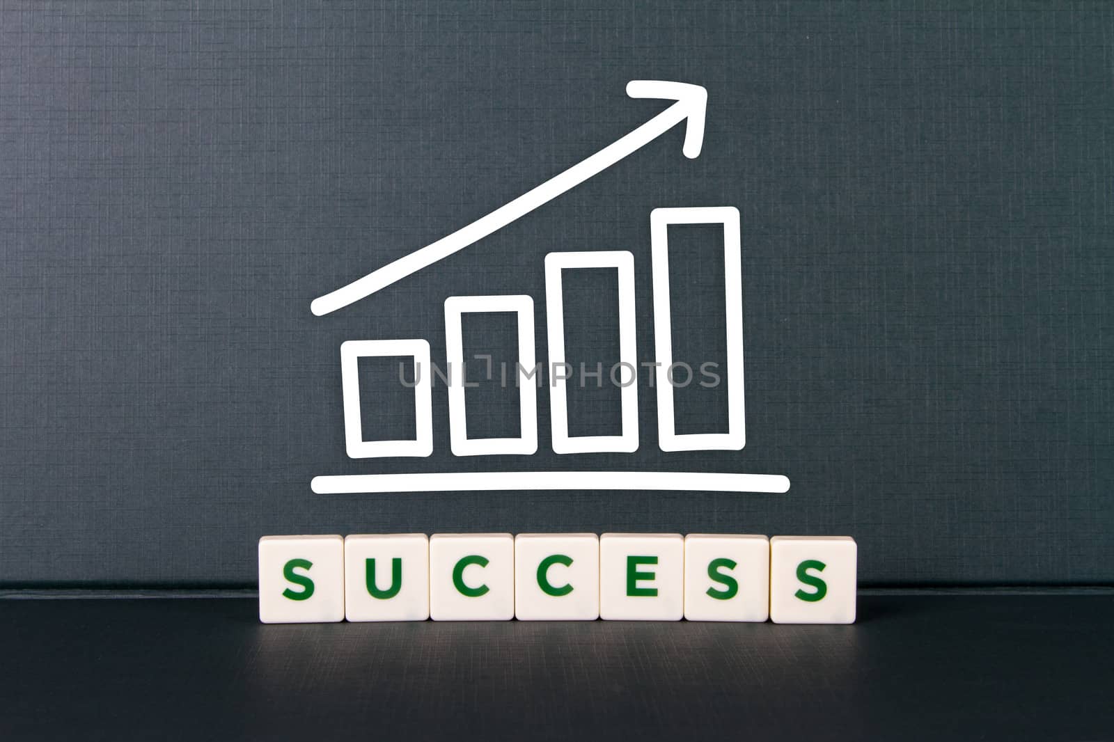 Success word in letters with bar chart of growth.