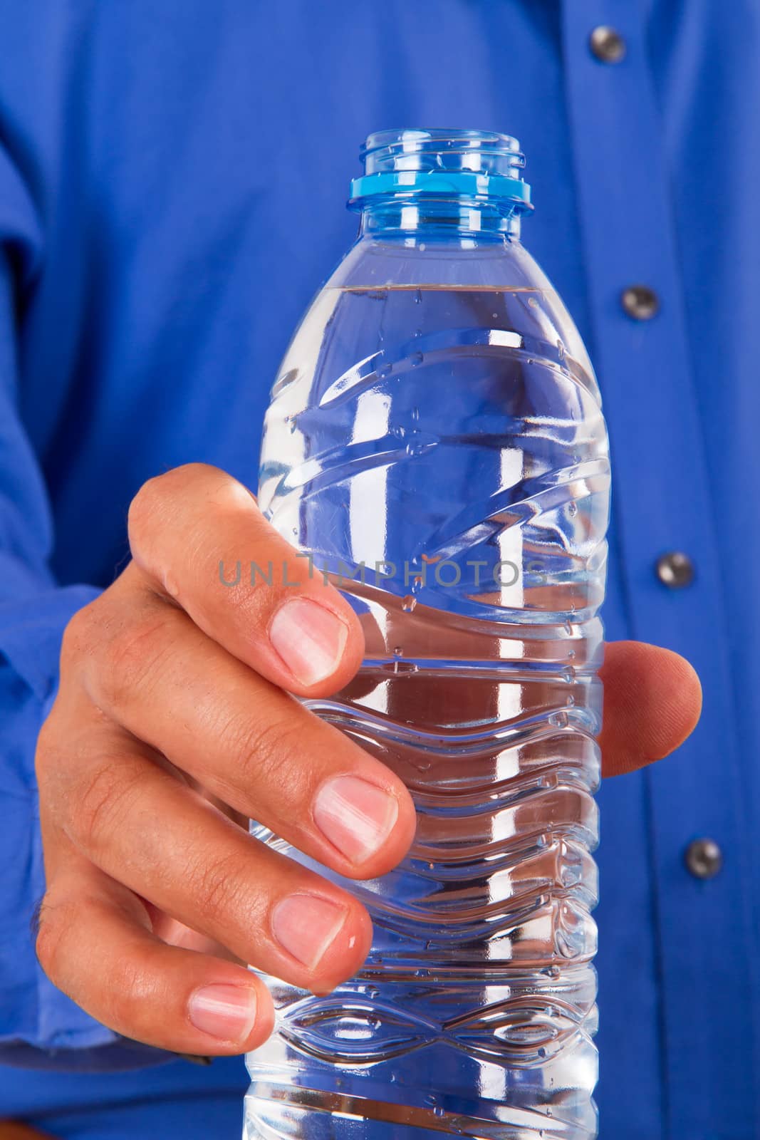 Businessman showing plastic water bottle.