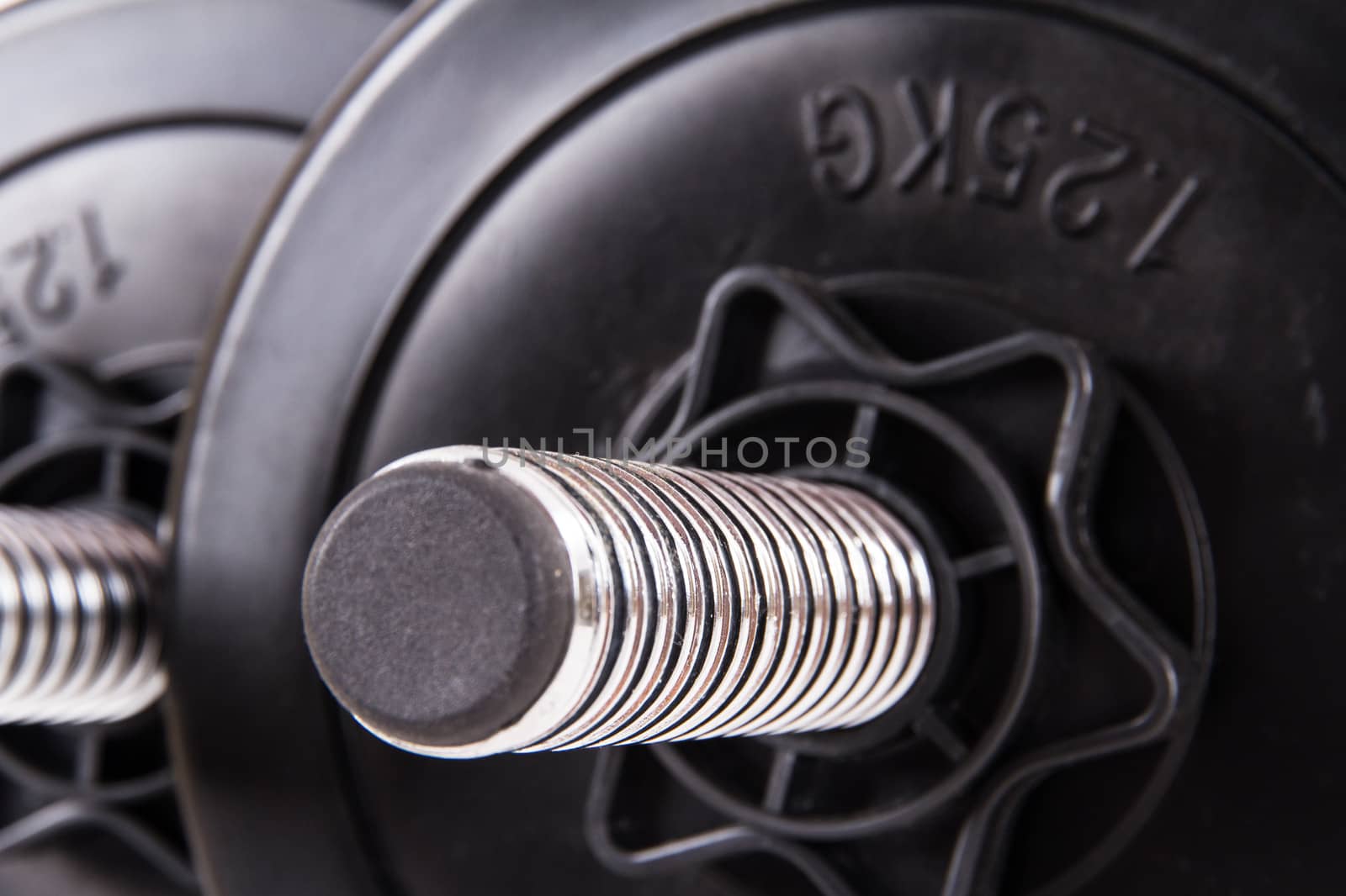 Black gym barbell, dumbbell with disks.