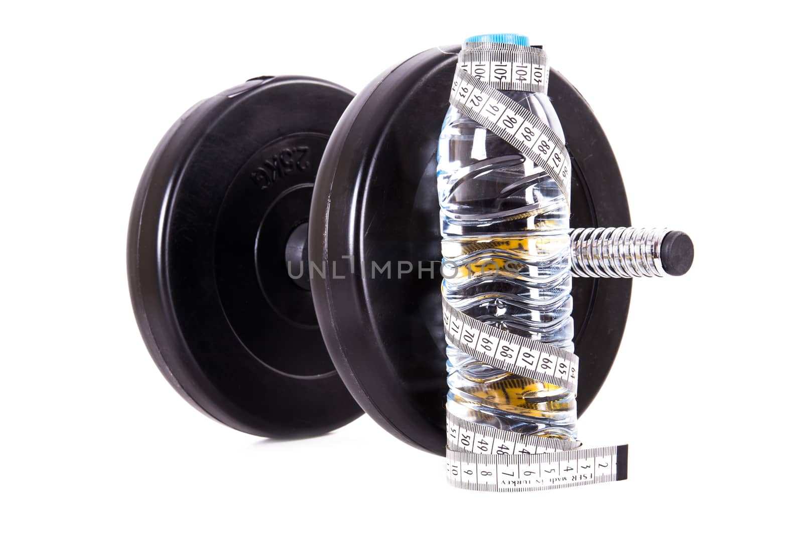 Plastic water bottle with tape measure and dumbbell, barbell, isolated on white background.