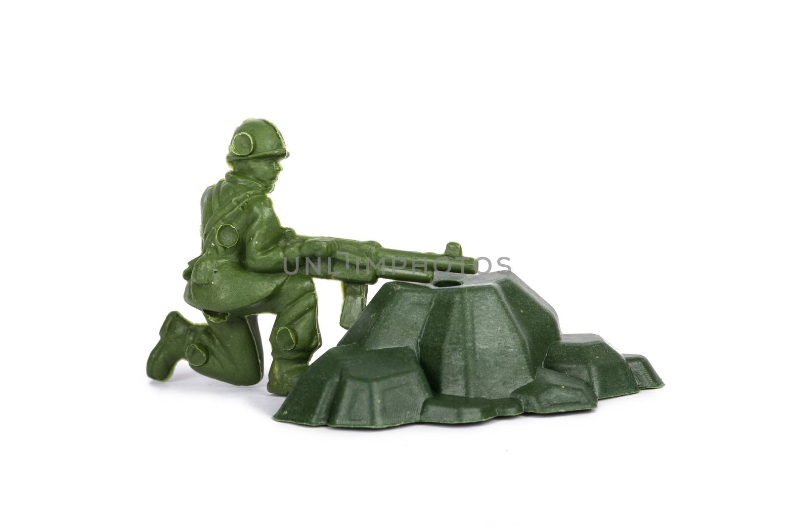 Miniature toy soldier, isolated on white background.