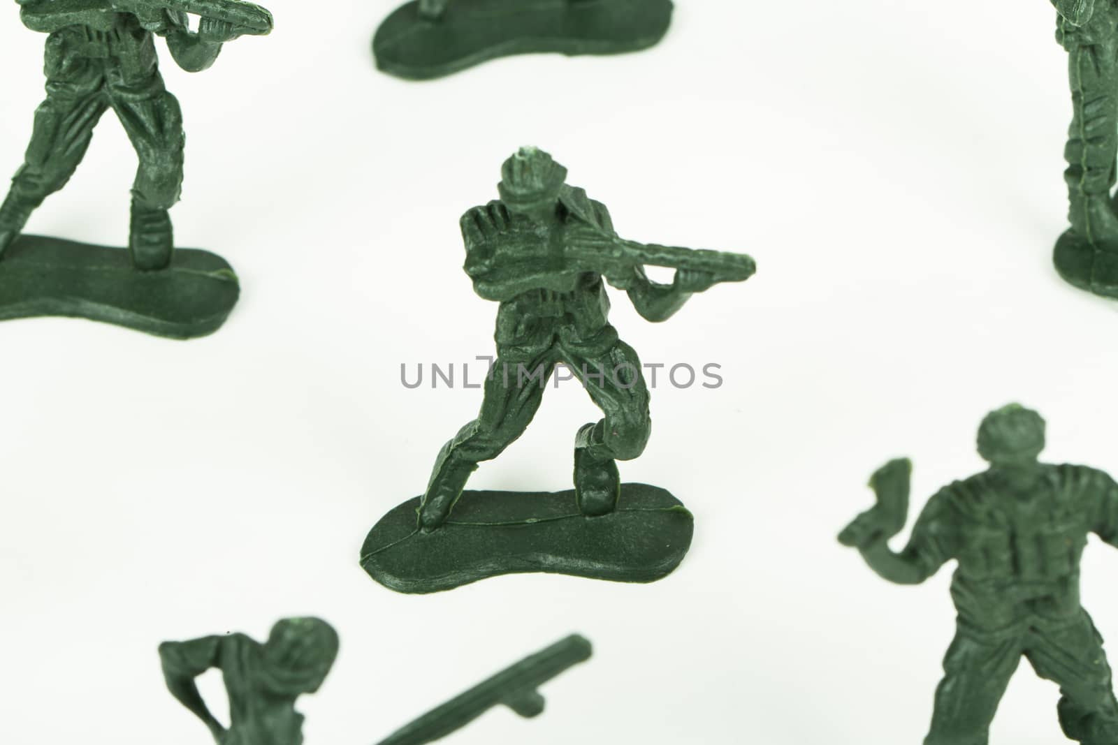 Miniature toy soldiers, isolated on white background.