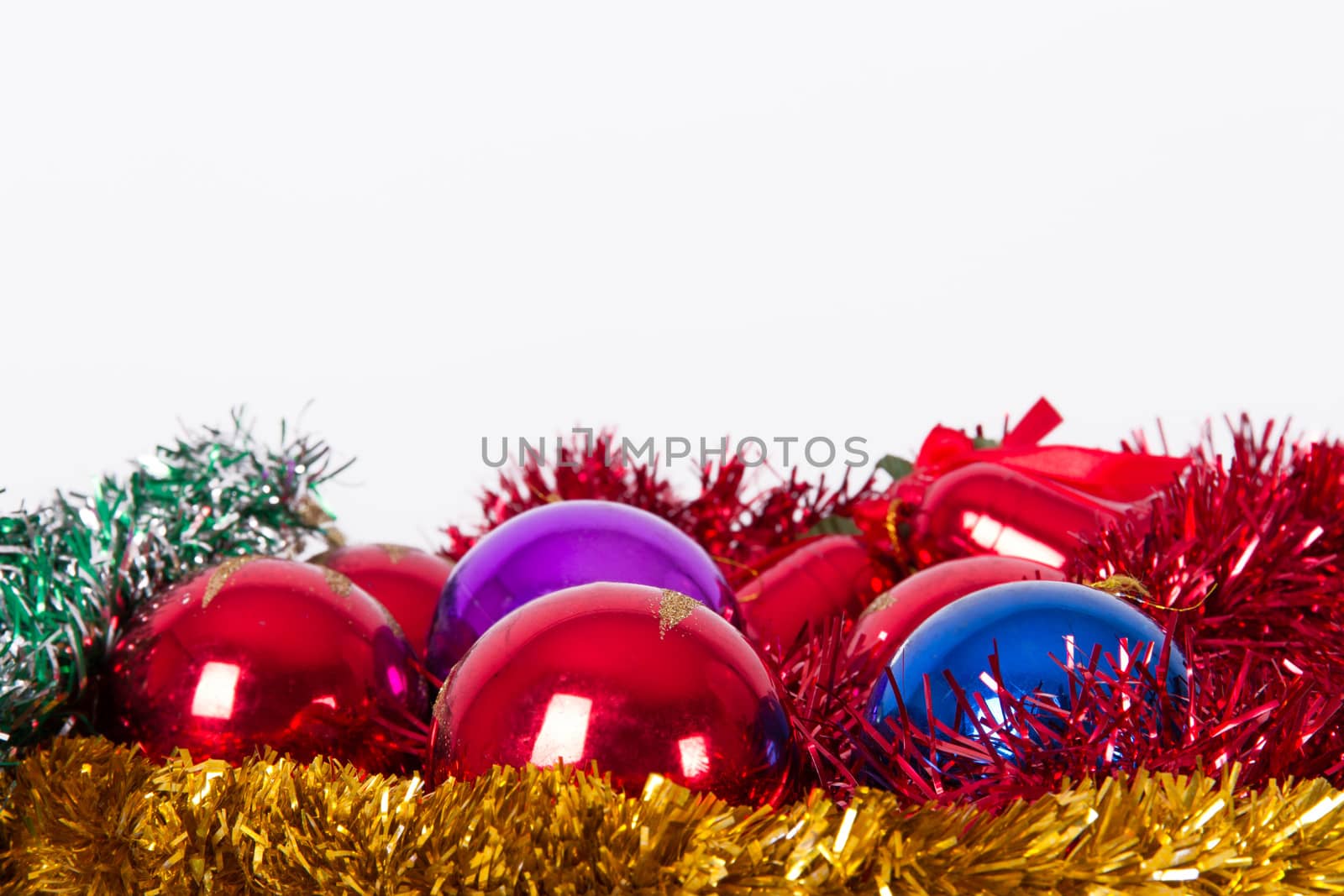 Christmas ornaments, balls, bells with space on top, isolated on white background.
