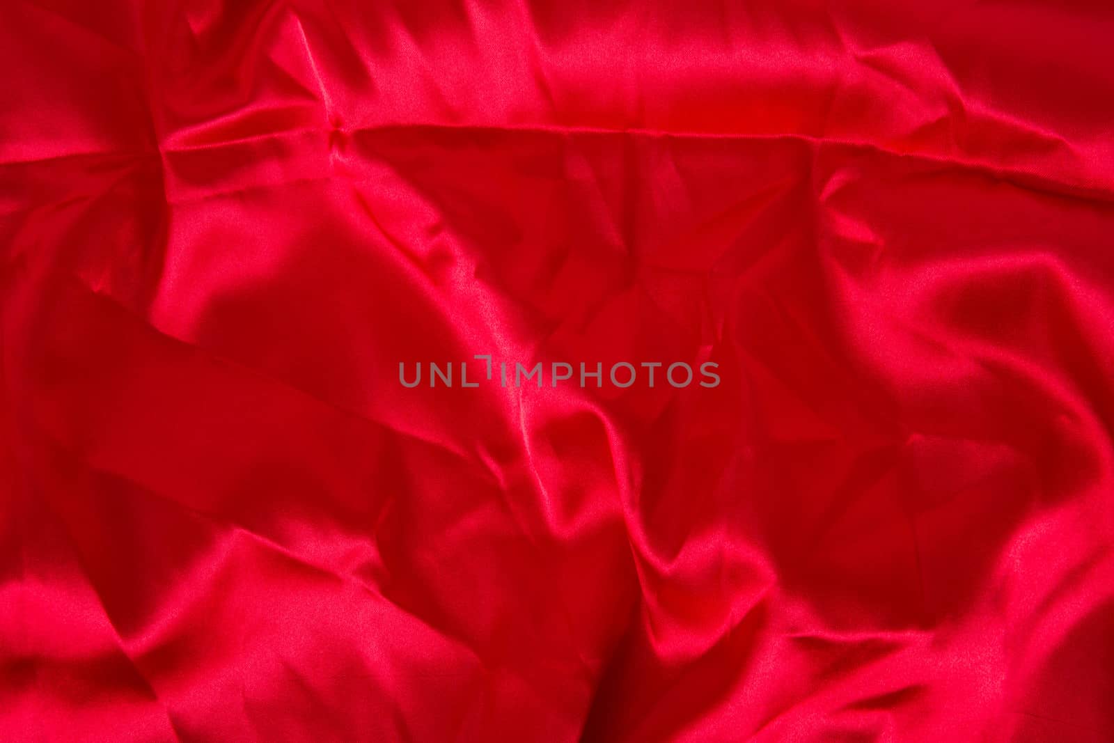 Abstract red background fabric,cloth, silk texture satin or velvet material.