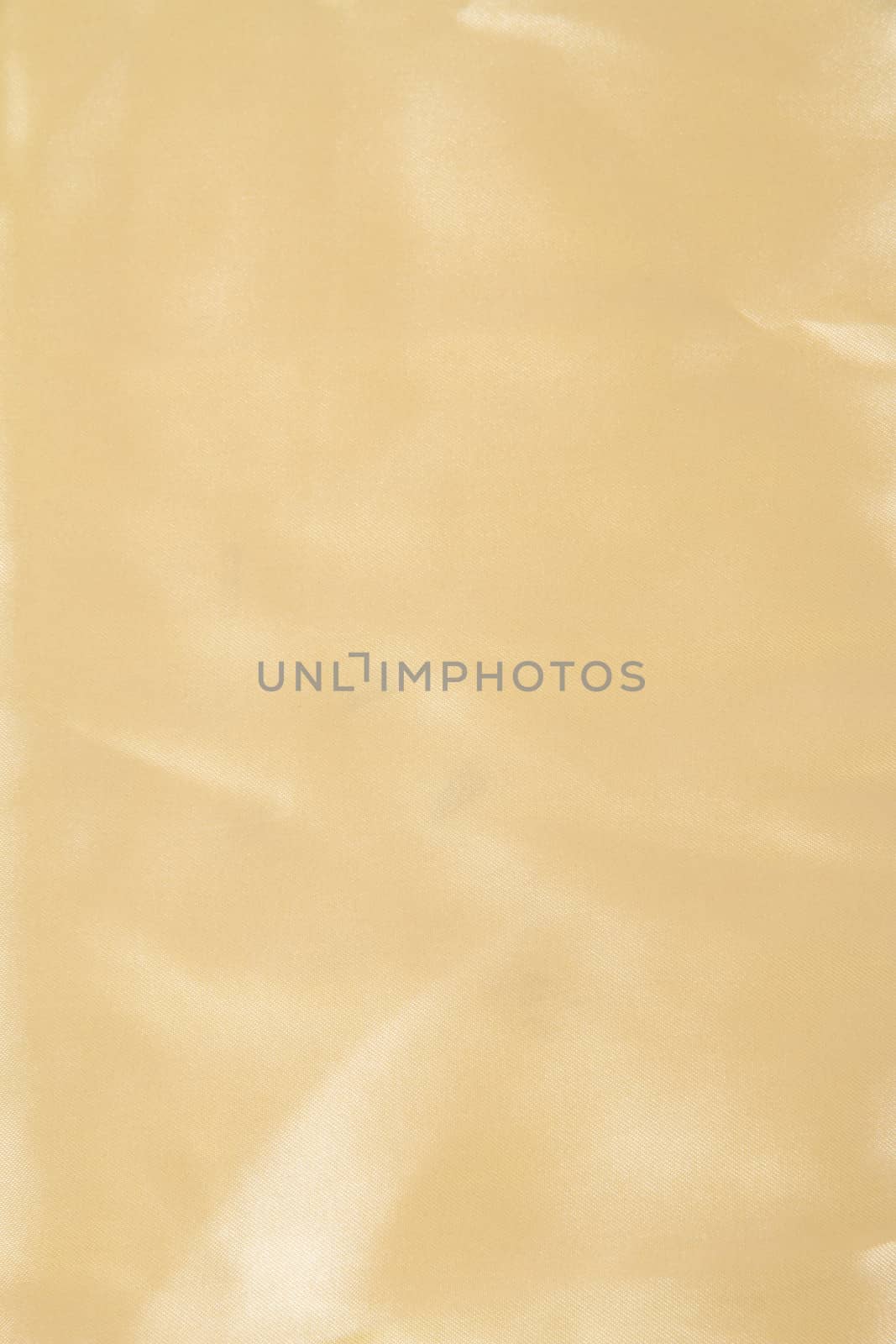 Abstract yellow background fabric,cloth, silk texture satin or velvet material.