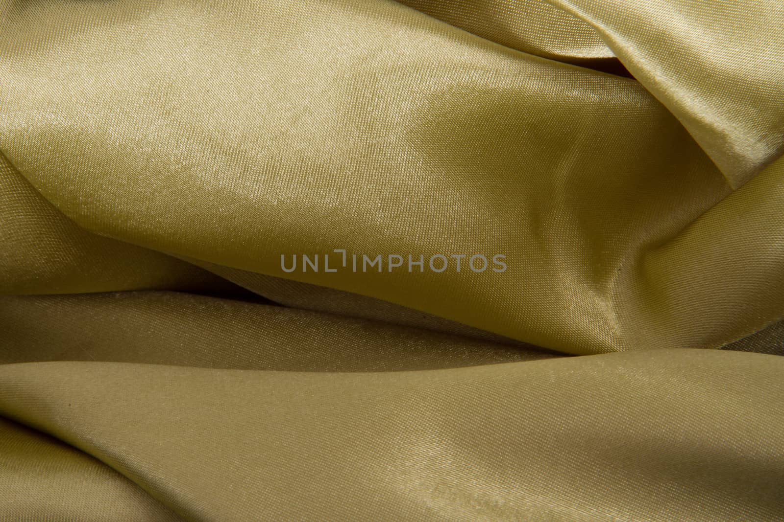 Abstract yellow background fabric,cloth, silk texture satin or velvet material.