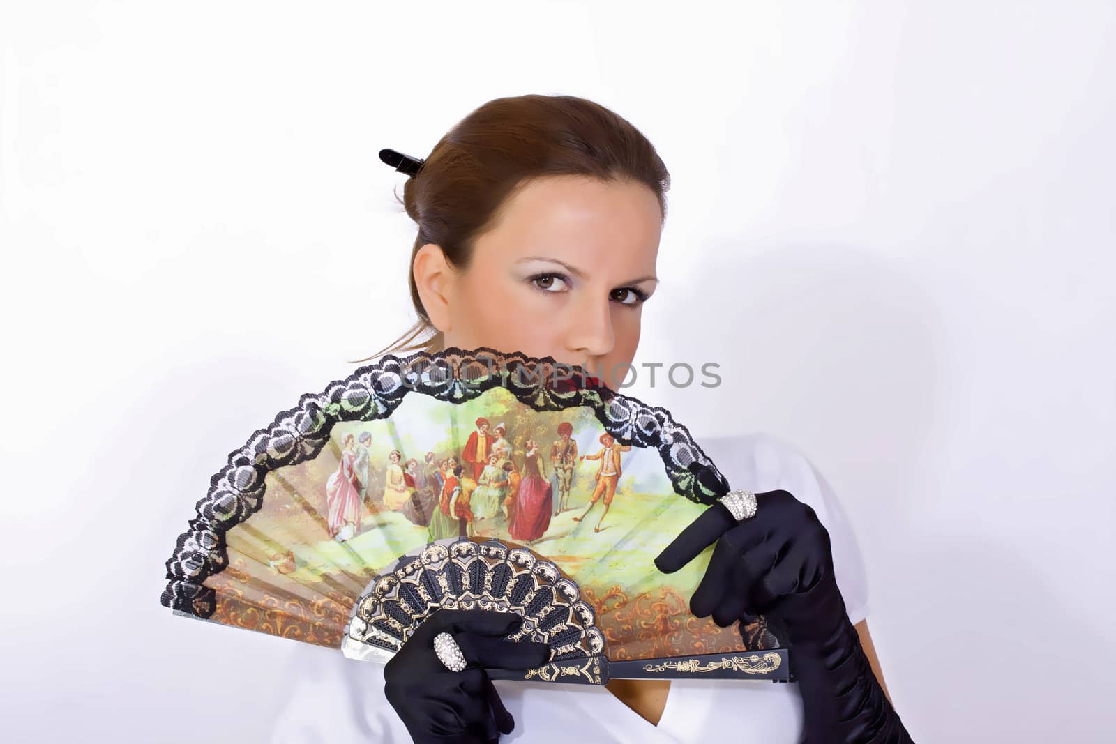 portrait of young woman with colorful fan