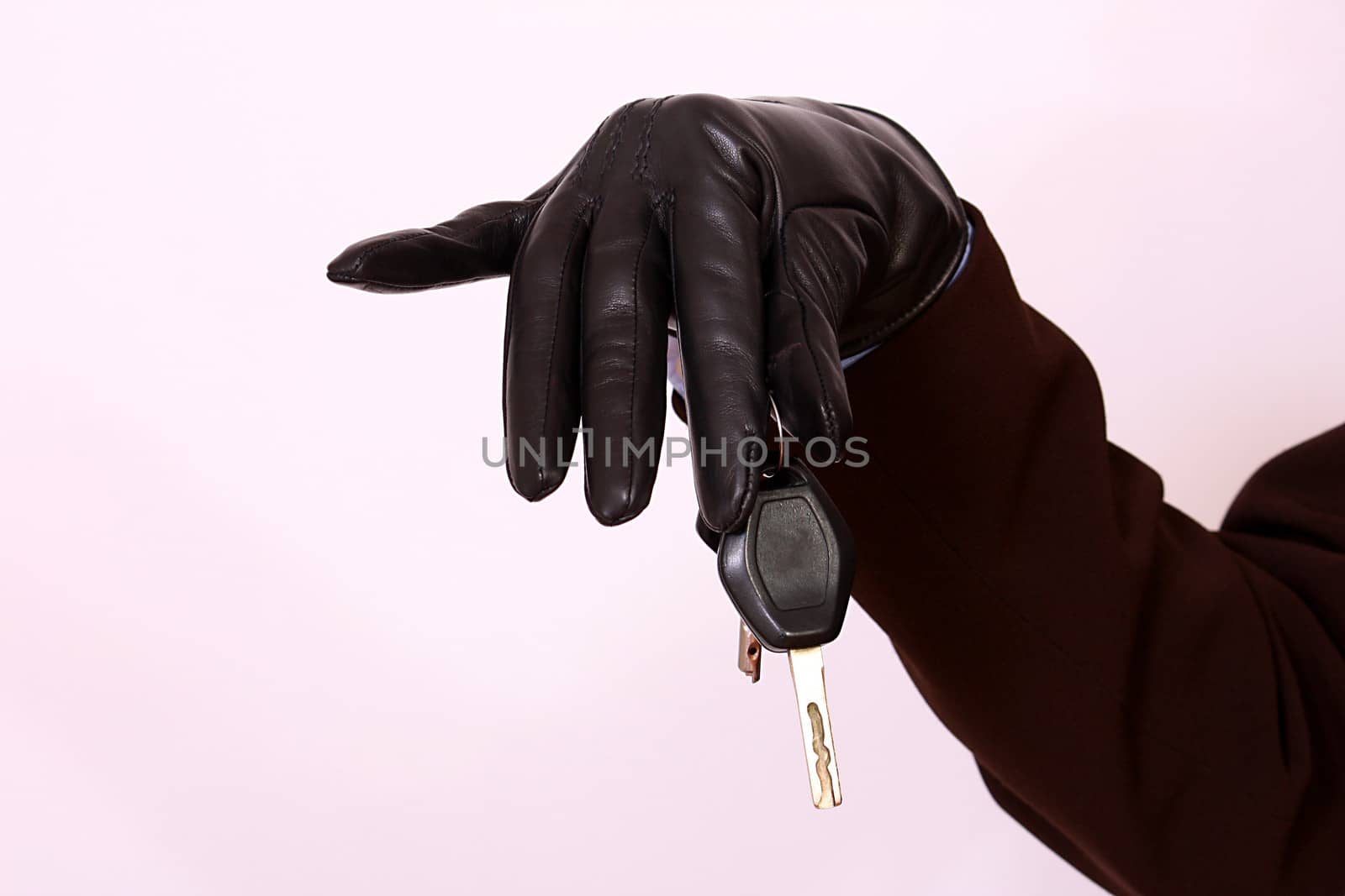 Gloved hand holding car keys by dukibu