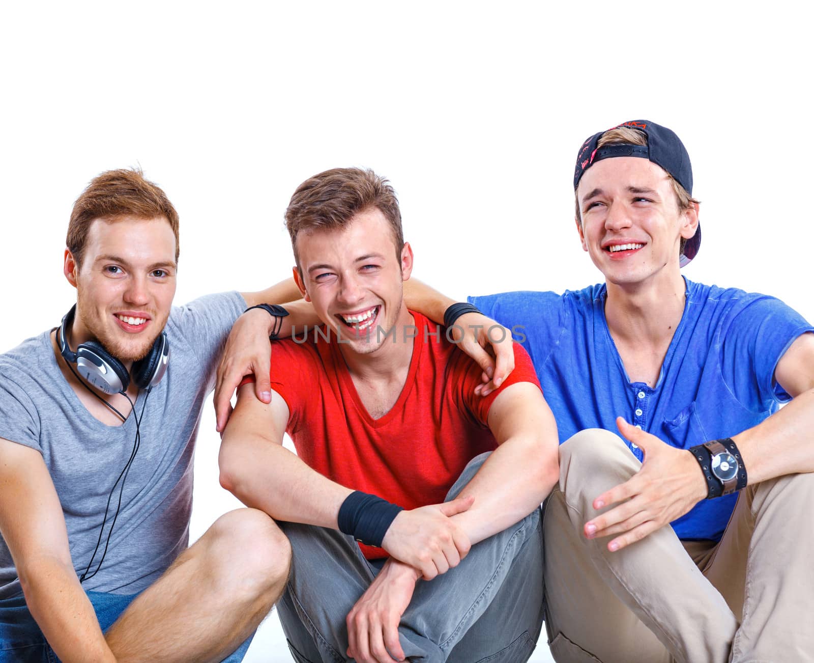 Portrait of three young happy smiling teenagers. Isolated on white background.