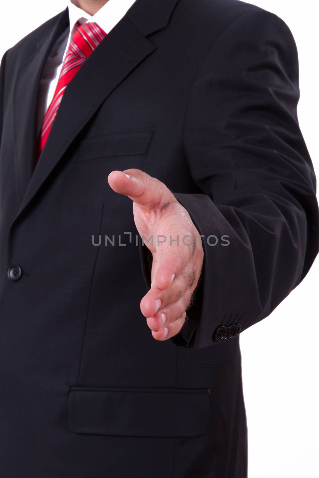 Businessman extends hand to shake or helping, isolated on white.