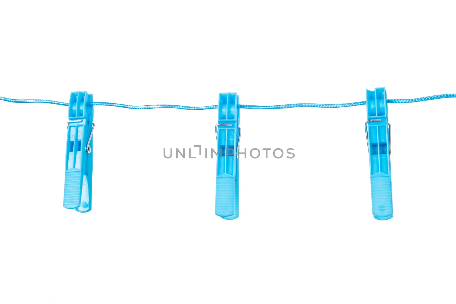 Three blue, plastic clothespins on nylon rope, isoalted on white background.