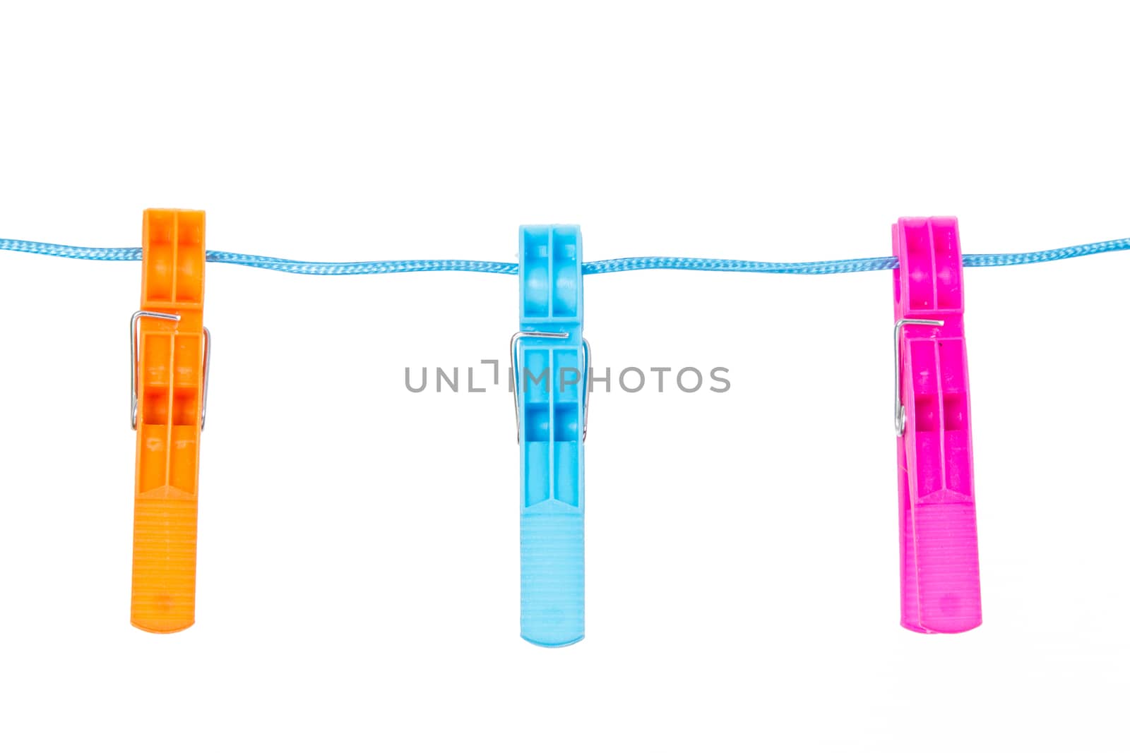 Colorful clothespins on blue nylon rope, isolated on white background.