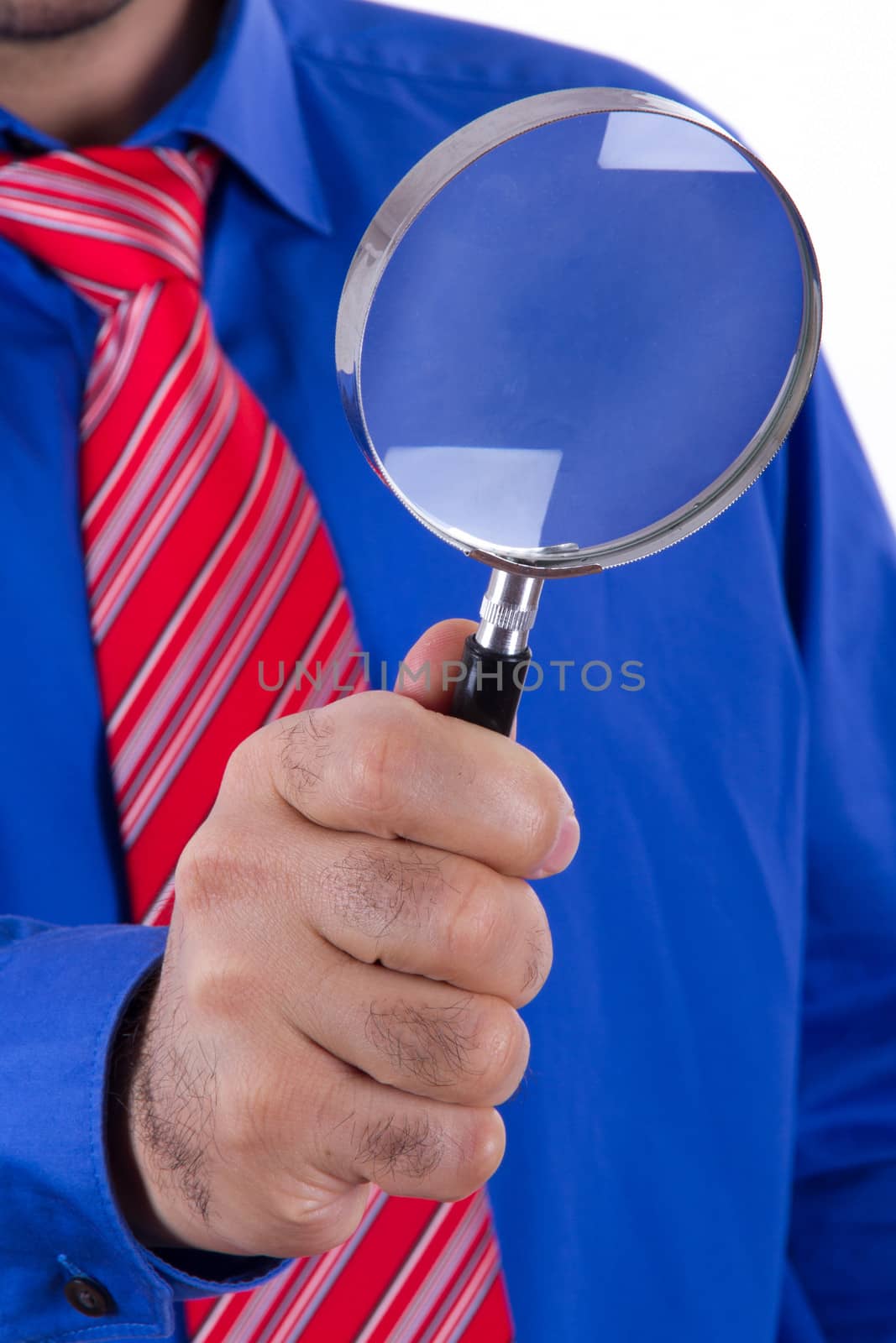 Businessman with red tie and blue shirt using magnifying glass and searching, isolated on white background.