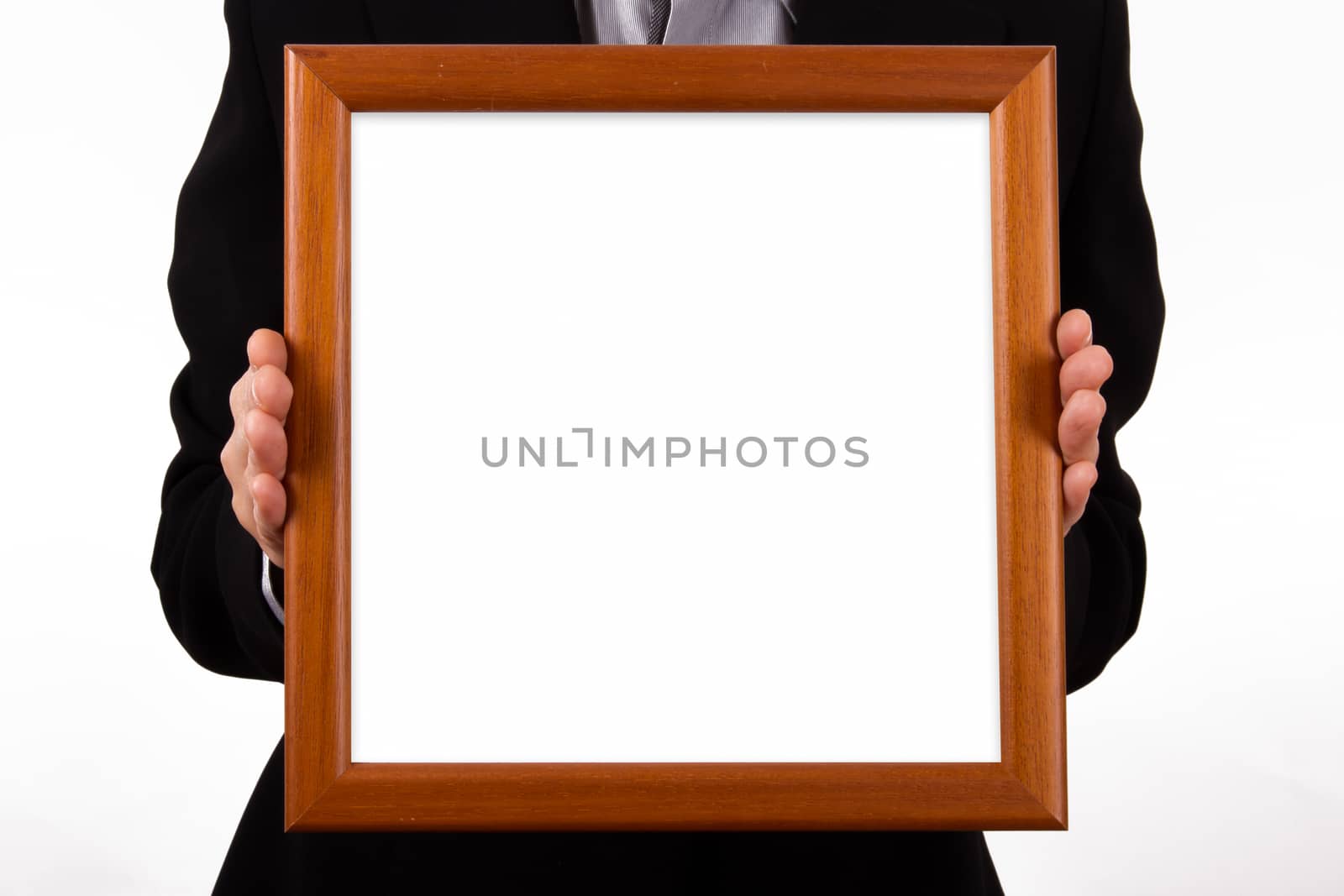 Business woman hand holding and showing white, empty, wooden bordered frame for your message or photo, isolated on white background.