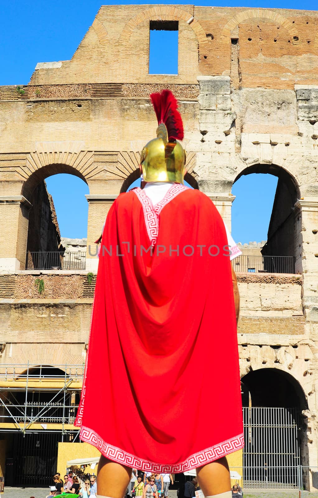 Rome, Italy - September 27, 2013: Roman legionary in ancient armour in front of the Colosseum in Rome, Italy. It has been estimated that over 500,000 people and over a million animals were killed there. 