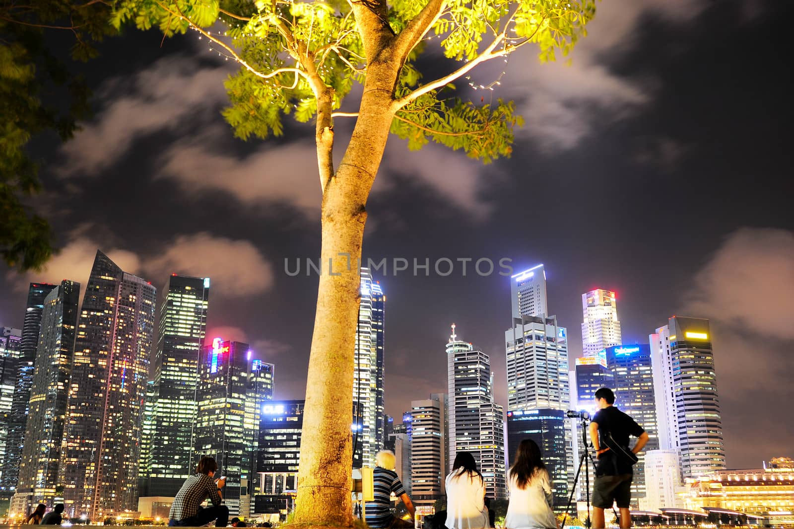 Singapore, Republic of Singapore - March 7, 2013: Unidentified people in front of Singapore downtown. Population of Singapore is 5.18 million people, of whom 3.25 million (63%) are citizens 