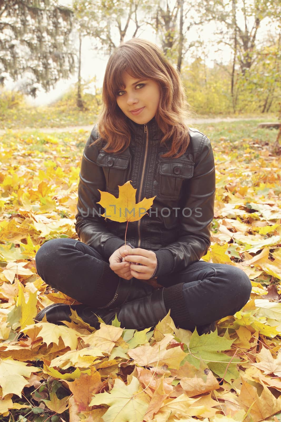girl sitting on the autumn leaves by Mallivan