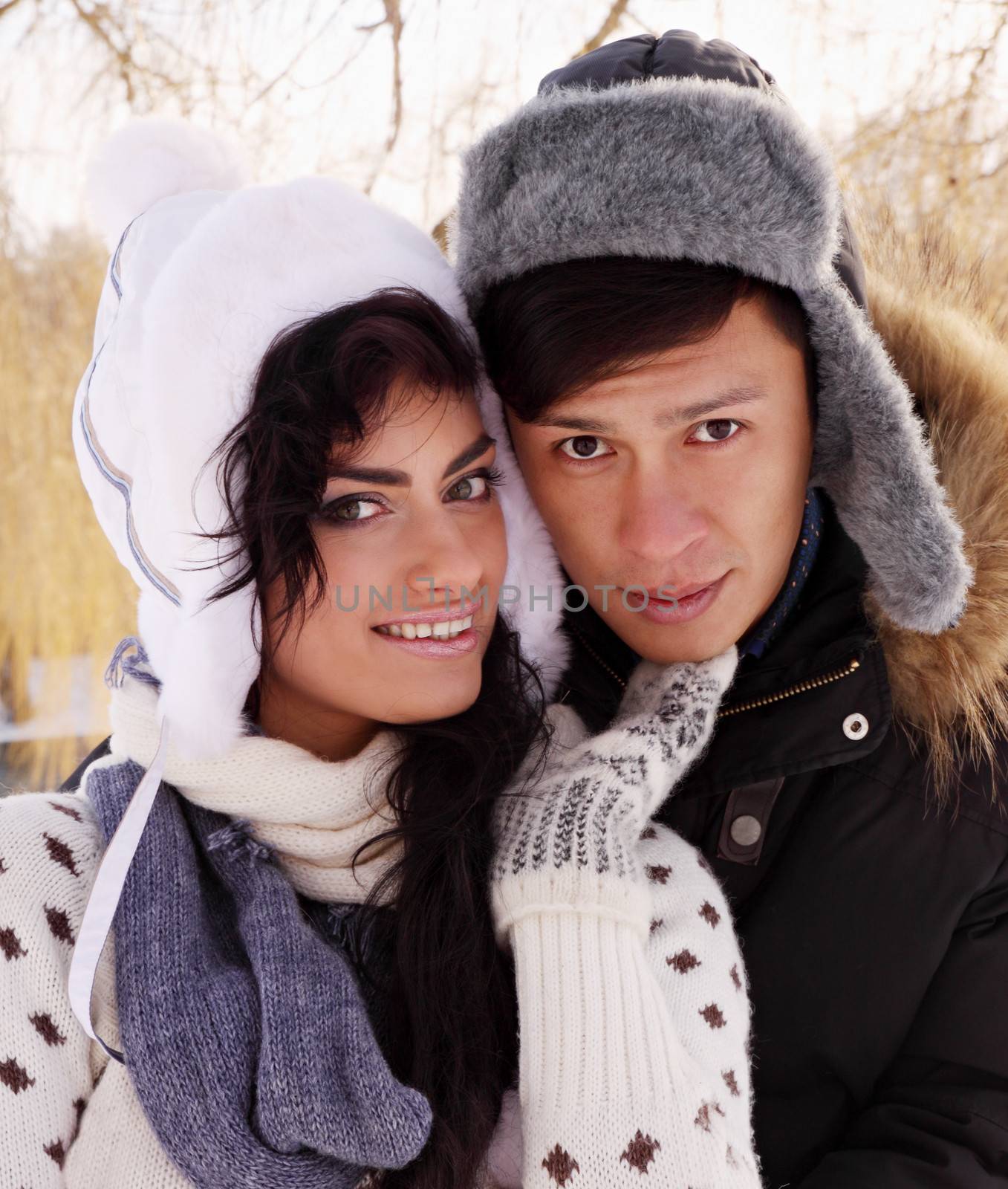 Young beautiful couple on nature in winter