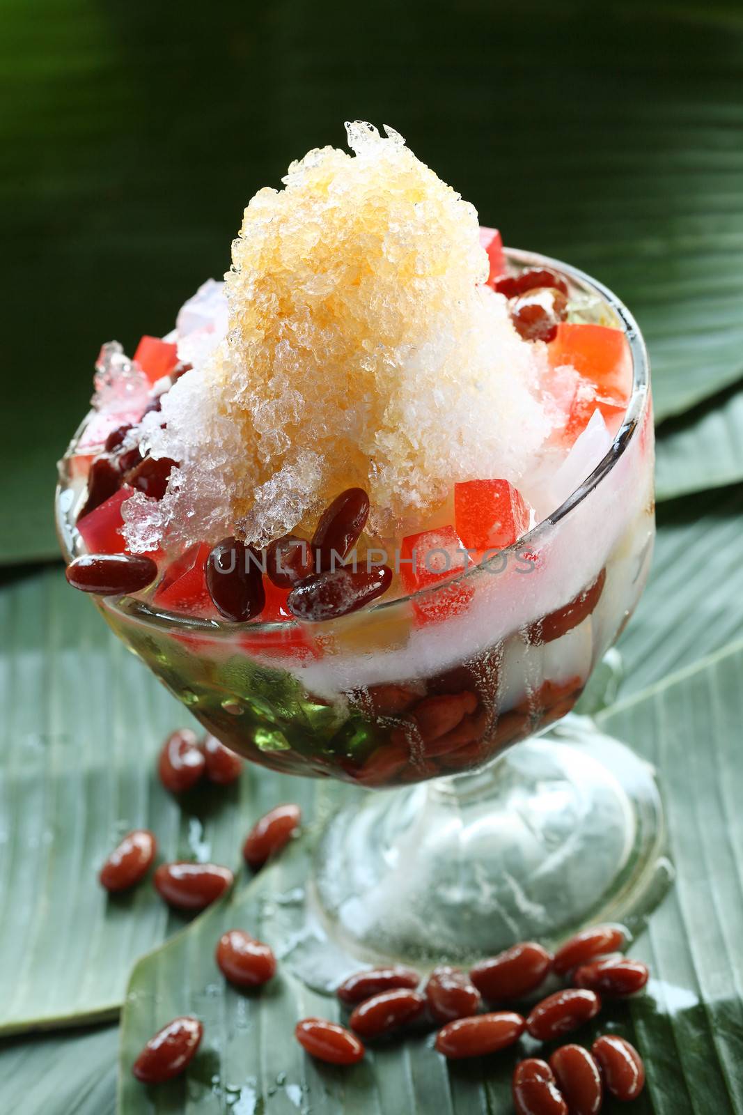 Mixed ice fruit dish (Es Campur). Indonesian cold beverage dessert by photosoup