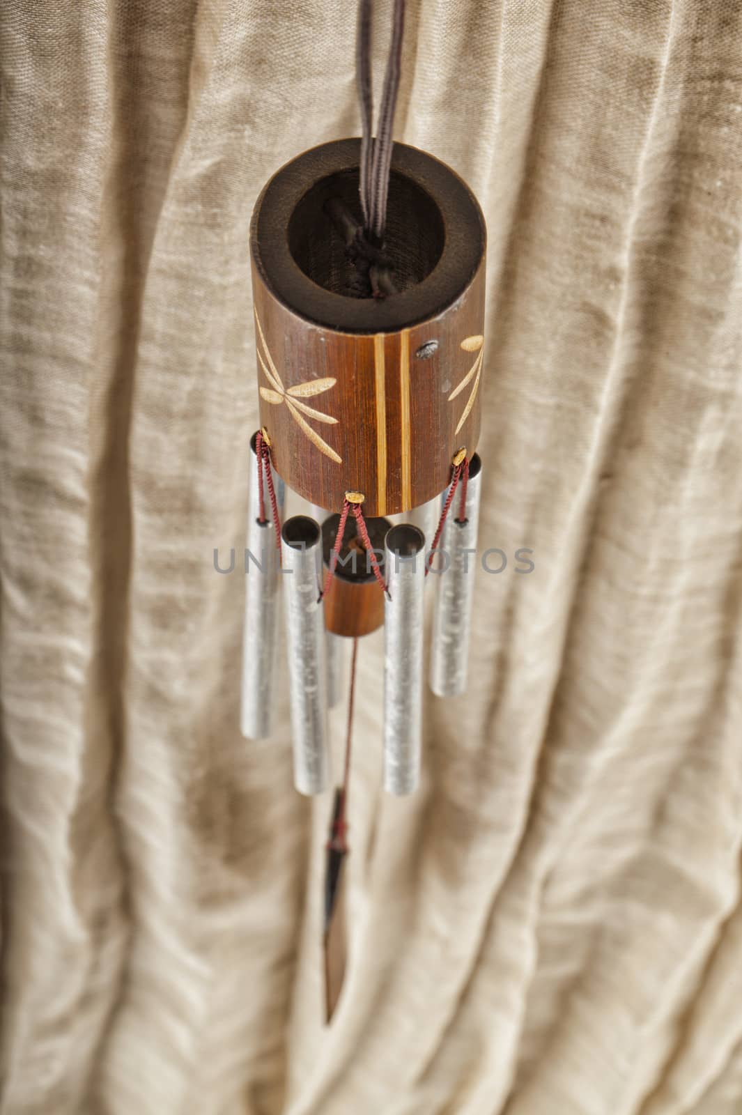 Close up from above of a wooden wind bell