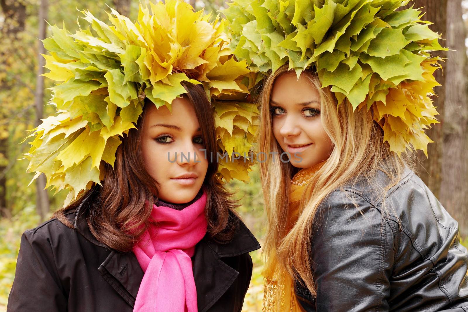 young womans wearing a wreath of autumn leaves