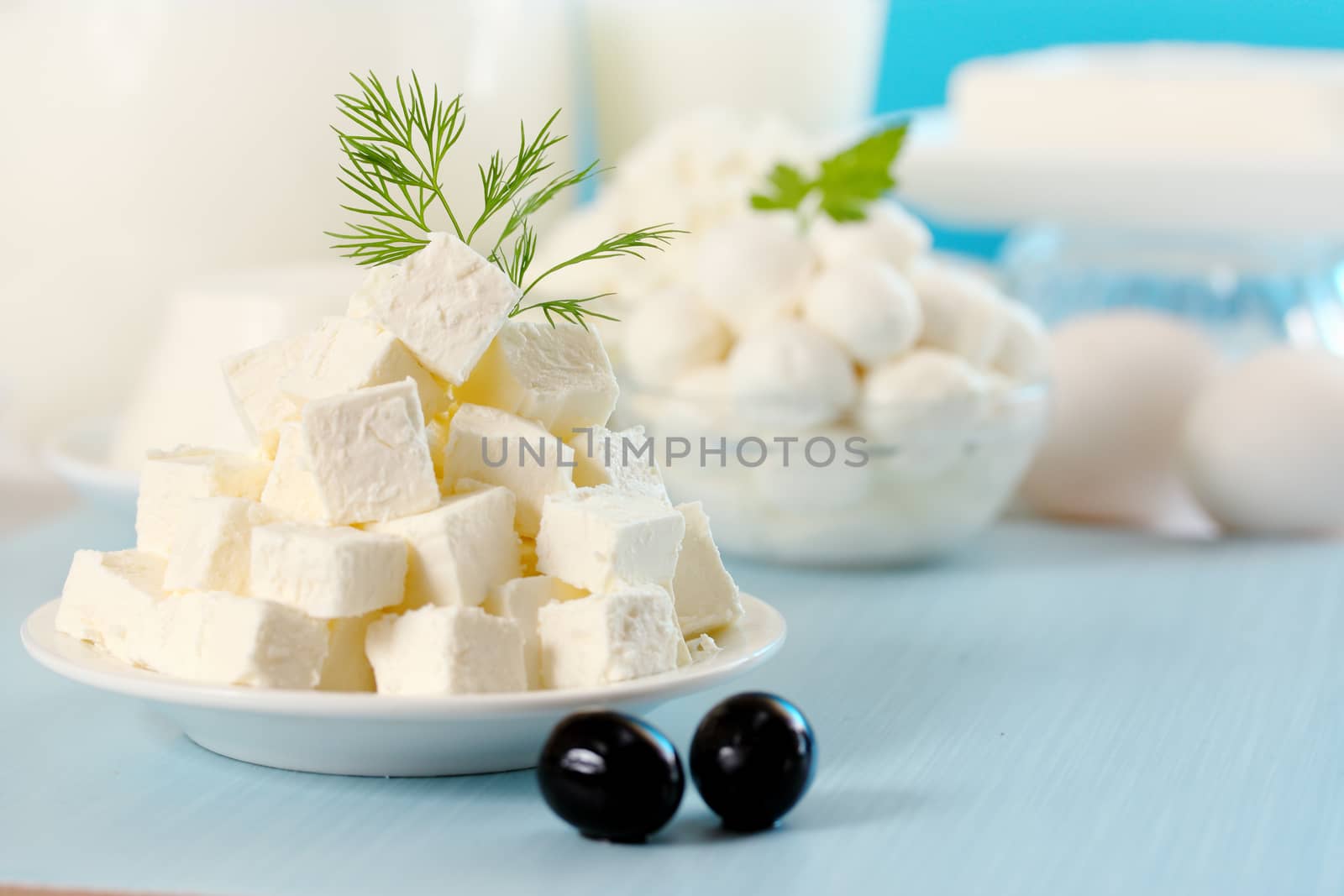 Feta cheese cut into slices on a plate