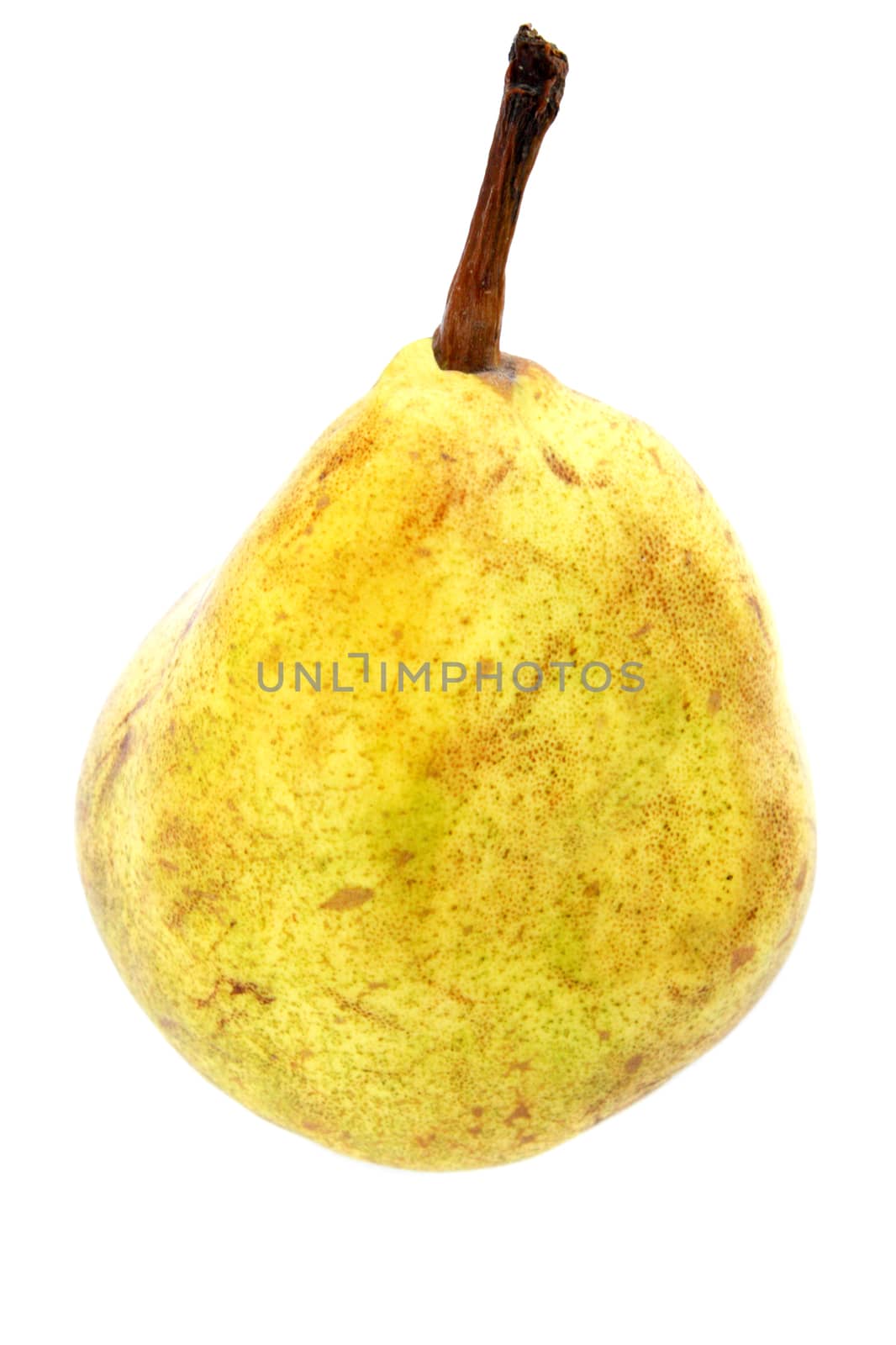 Yellow, spotted pear by closeup against the white background