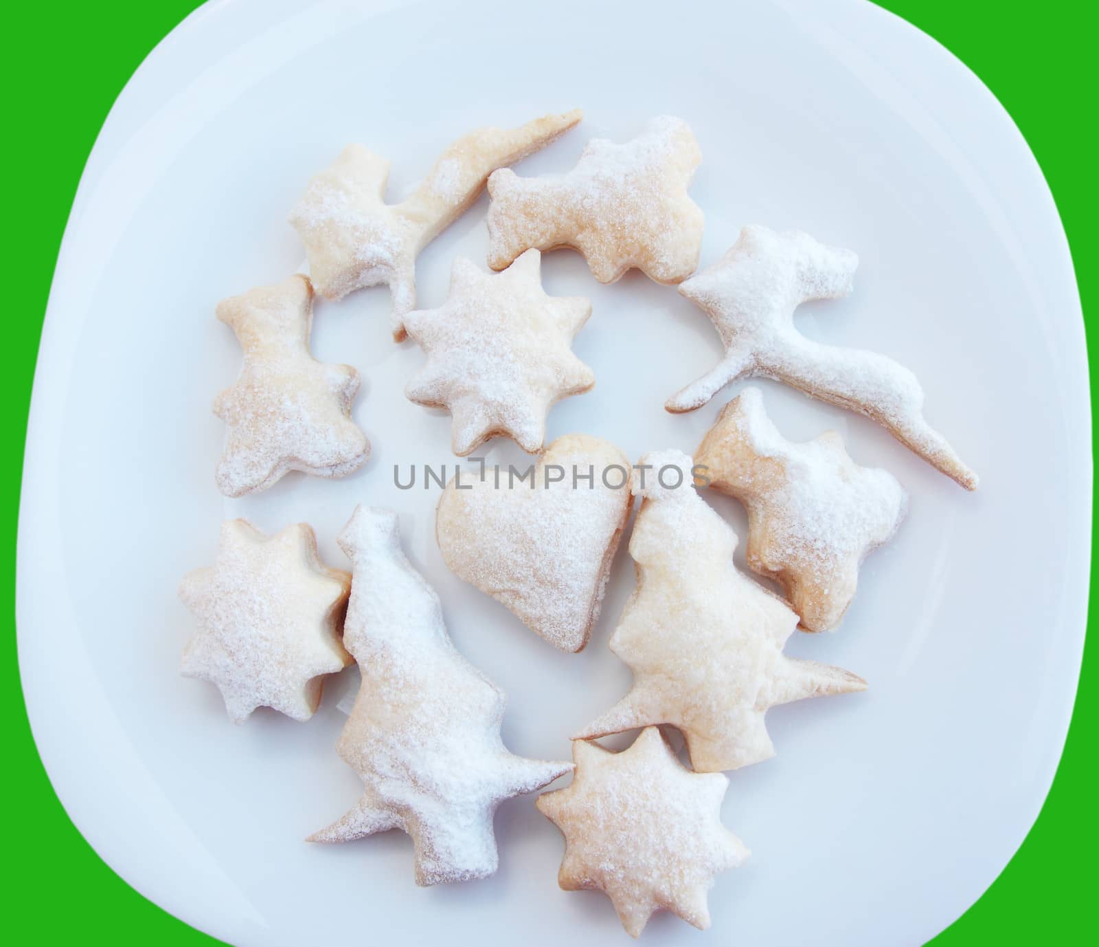 Christmas pastry with the powdered sugar on the white plate