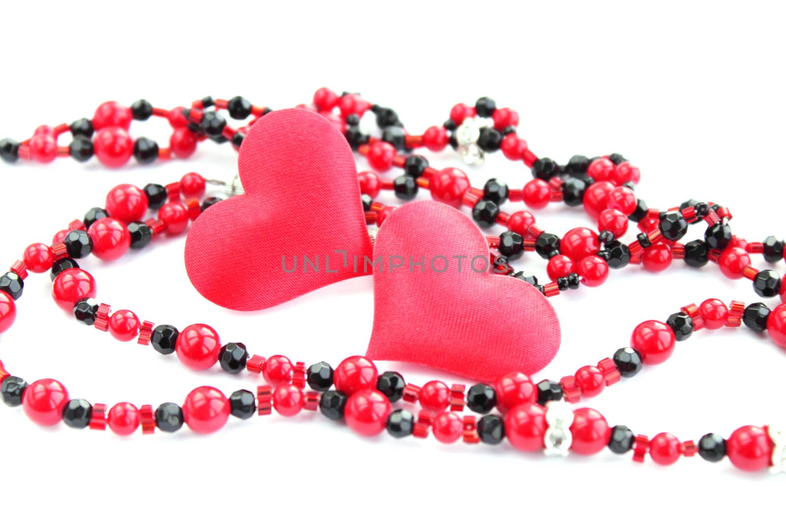 Pair of hearts with the beads during the day of saint Valentina