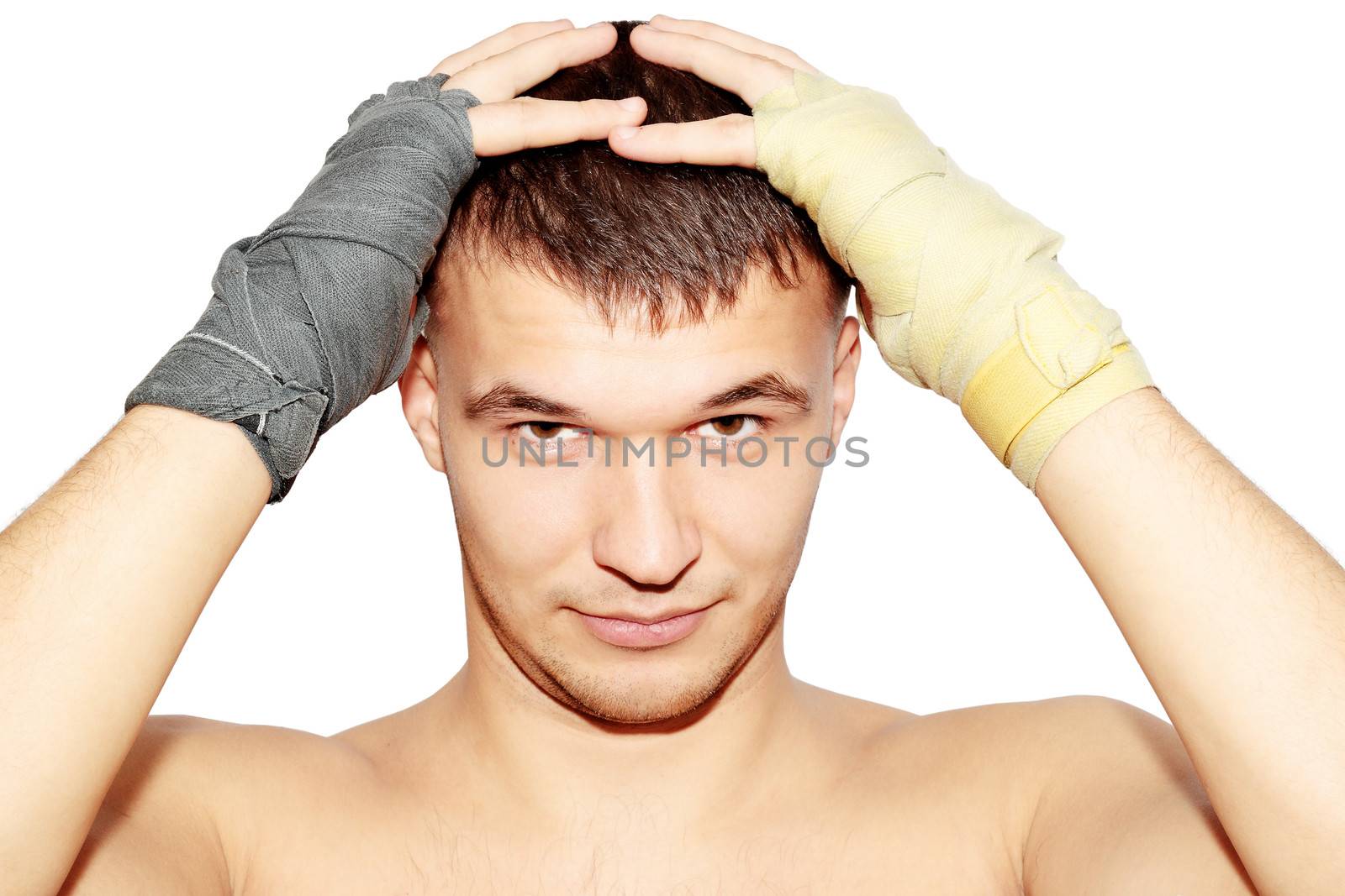 Man in the boxer bandages is held for the head