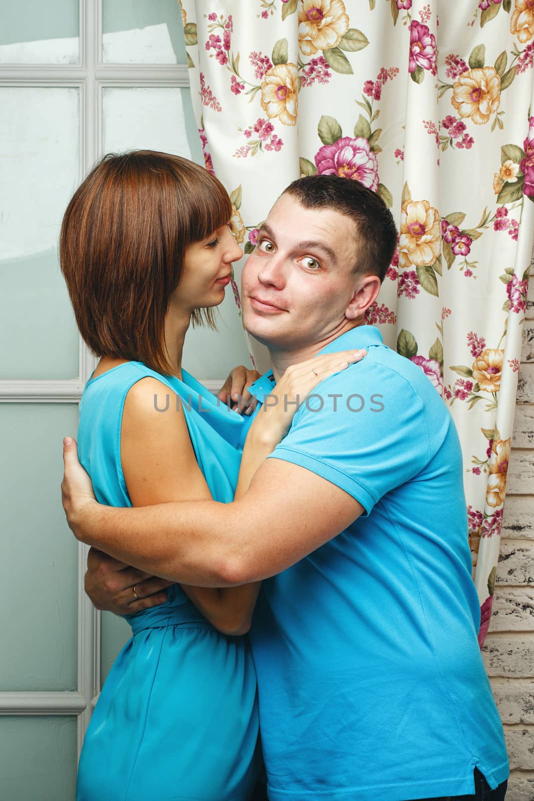 Man and woman embracing in a studio shot