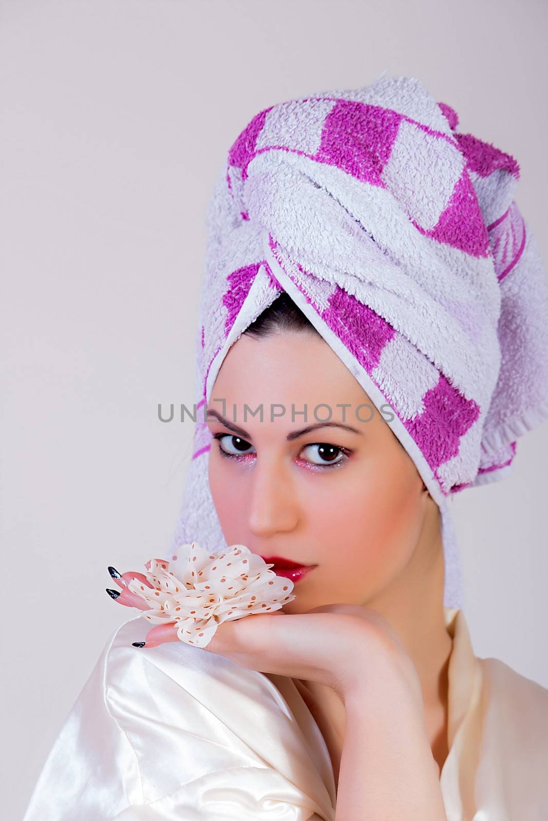 Young beautiful woman with towel on her head by dukibu