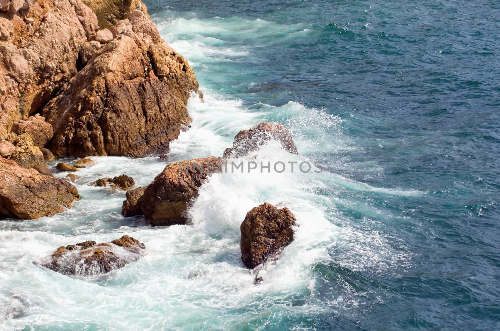 Sea waves lapping on the rocks