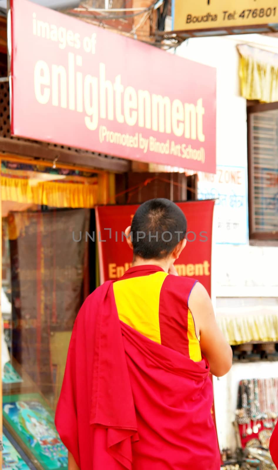 bodhnath stupa in kathmandu with buddha eyes and prayer flags on clear blue sky background