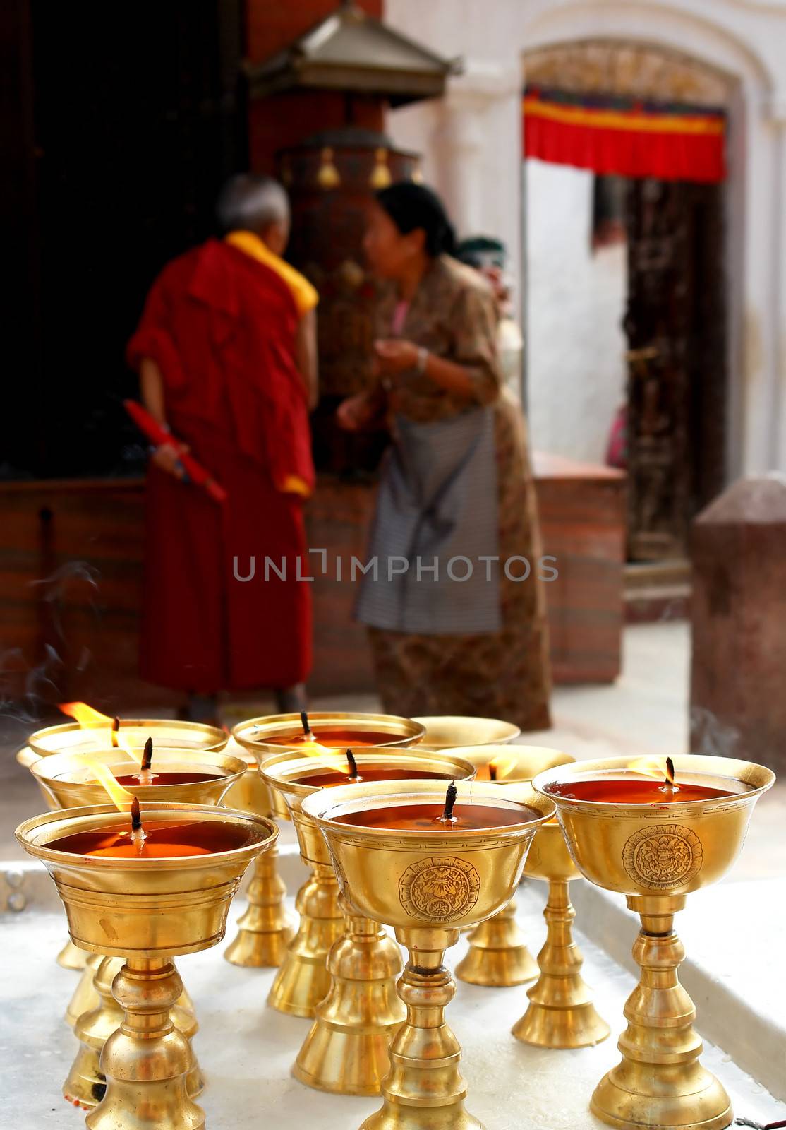 Praying candles in bodhnath stupa by ptxgarfield