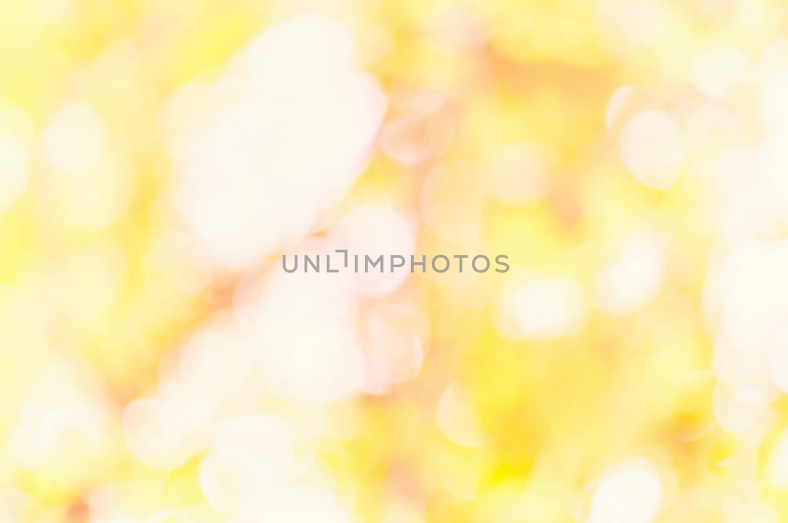 Orange color bokeh. Gold abstract christmas background by sfinks