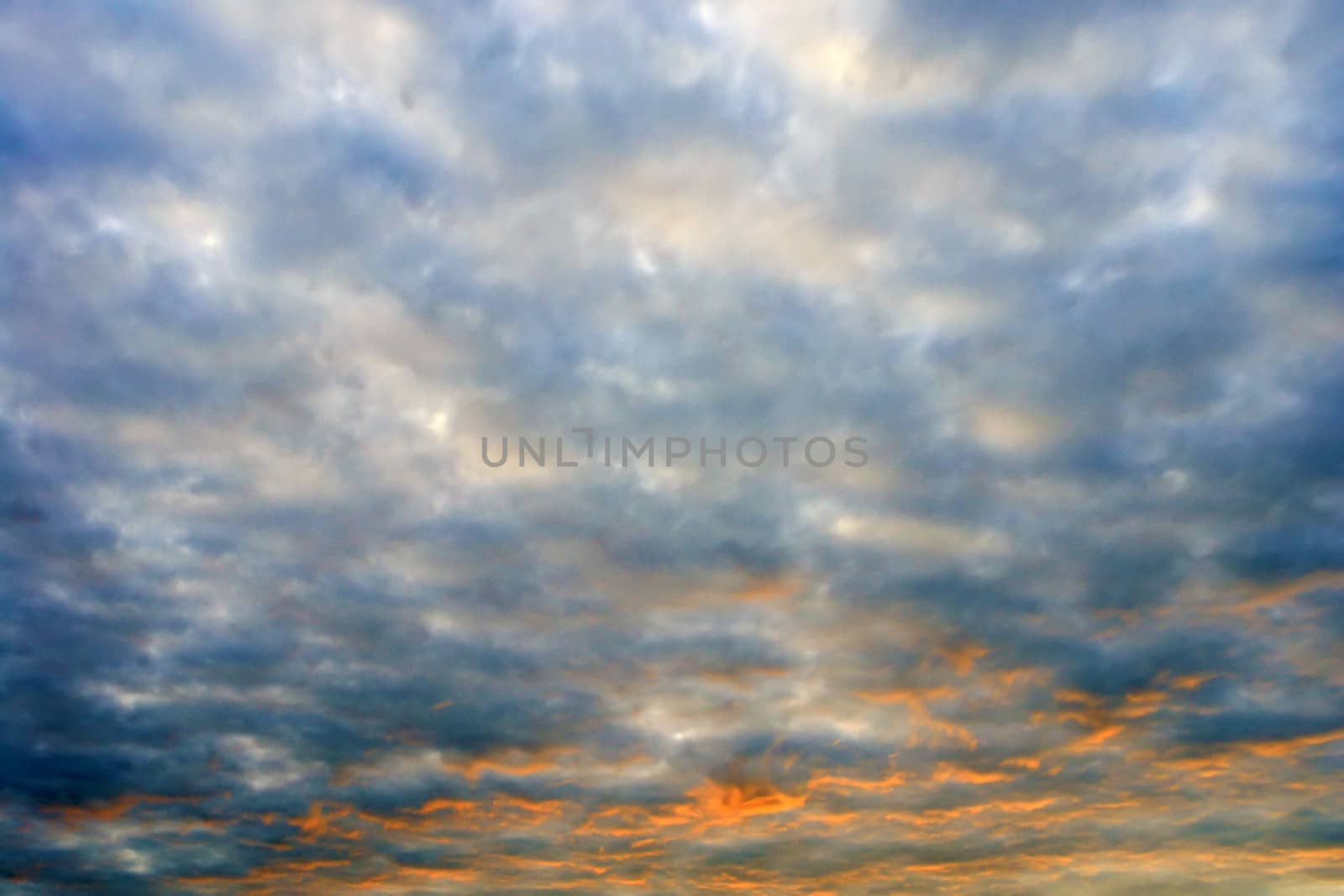 sunlight rays and clouds on the blue sky background
