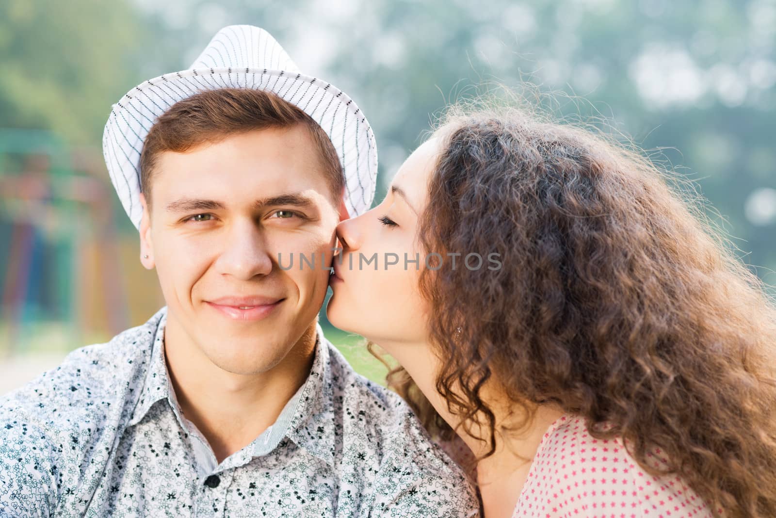 girl kissing a man on the cheek, spending time with loved ones