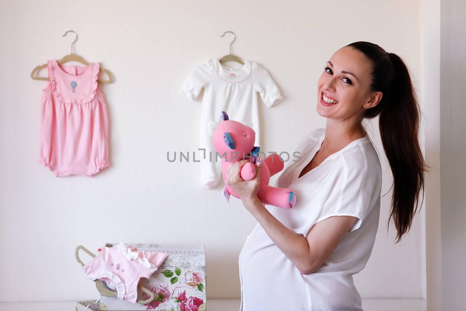 Happy beautiful pregnant woman at home