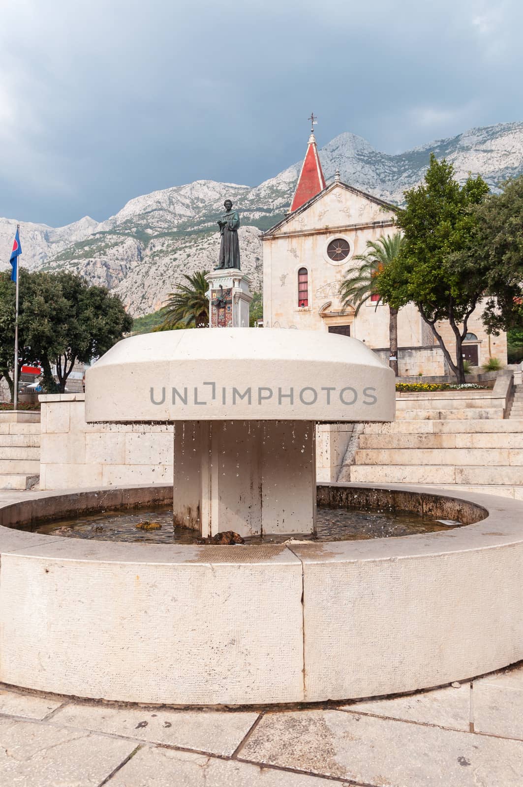 Fountain in front of St. Mark's Church on Kaciceva square, Makarska, Croatia.