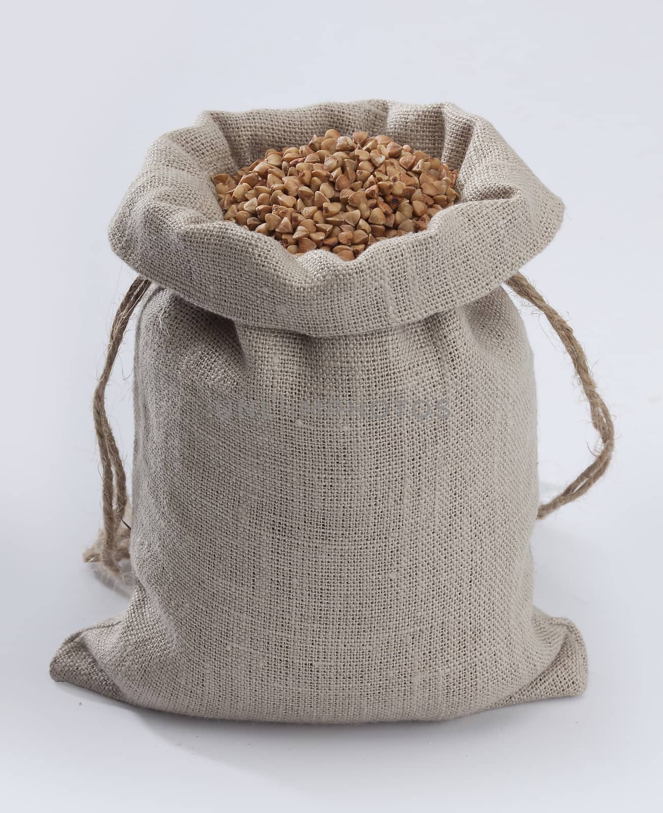 Buckwheat in the sack on the gray background